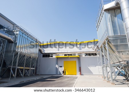Sofia, Bulgaria, September 14, 2015 - Waste processing silos and pipelines installation for processing recycled waste material and bio gas in a recycling waste to energy factory.