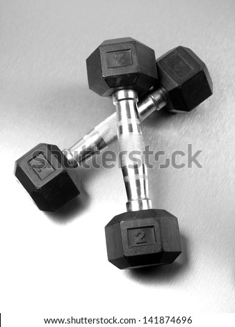 Gym sporting equipment on metalic background