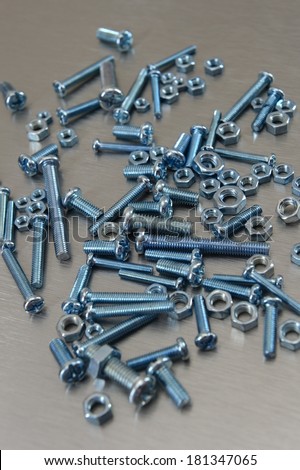 Nuts and bolts isolated against a white background