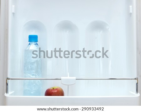 A shot of an open bar fridge