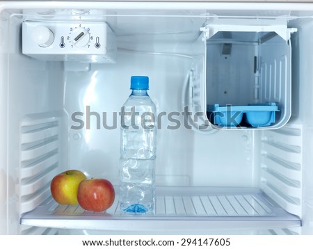 A shot of an open bar fridge