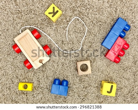 A close up shot of toys scattered on the floor