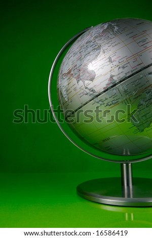 World globe isolated against a green background