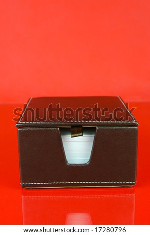 A note block isolated against a red background