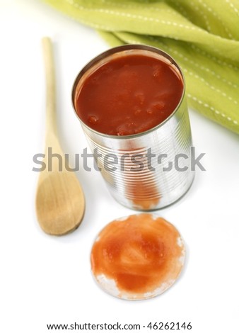 A can opener and a tin can isolated against a white background