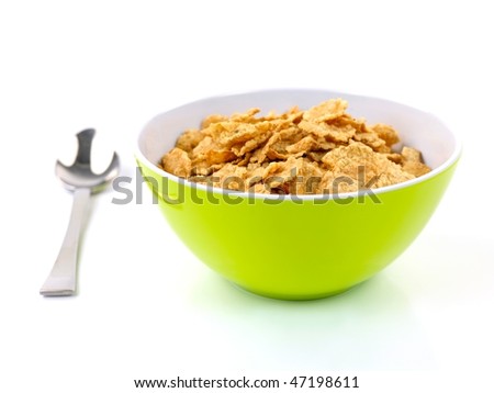 A bowl of breakfast cereal isolated against a white background