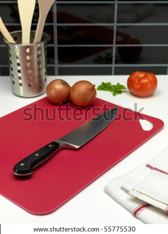 A chopping board on a kitchen bench