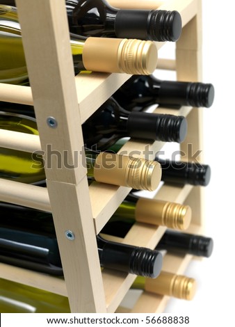 Bottled wine and a wine rack isolated against a white background