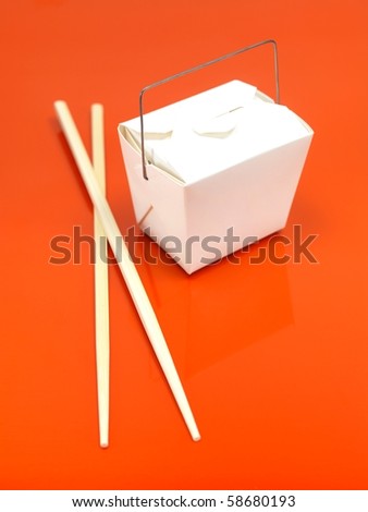 A Chinese takeaway container isolated against an orange background