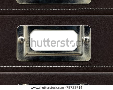 An office tray label on a leather tray