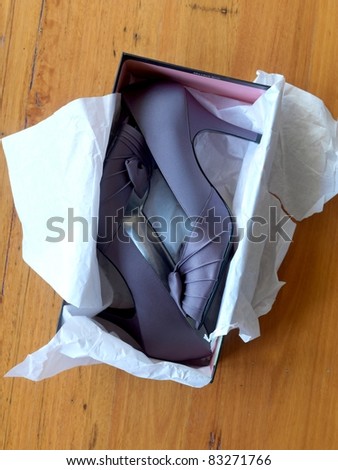 Ladies high heeled shoes in a shoe box
