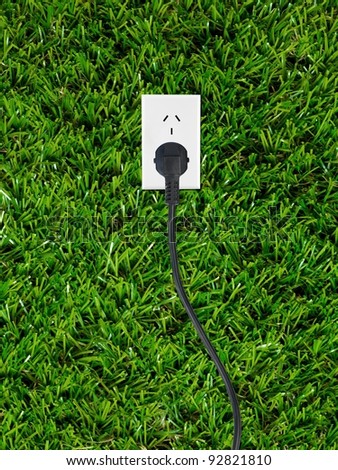Conceptual renewable images isolated against artificial lawn