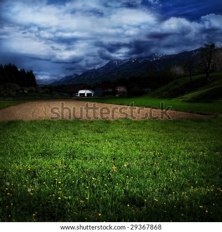 Idyllic country landscape and dramatic blue sky