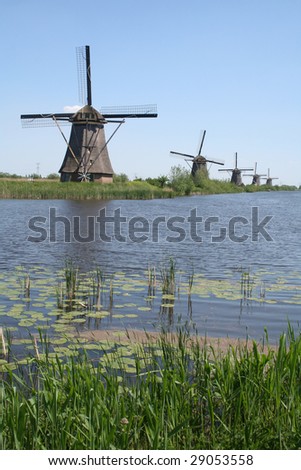Beautiful scene of water and a historical windmill