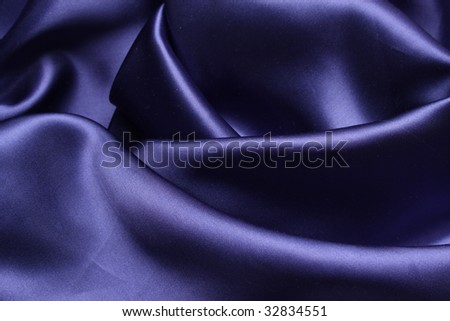 A sheet of blue satin carelessly draped