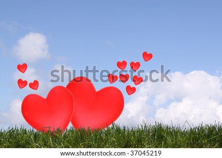 Red hearts in a free open sky