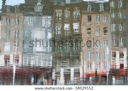 Nice typical houses of Honfleur reflected in water