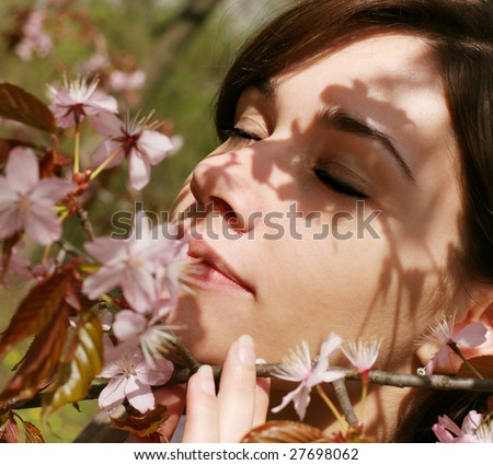 Beautiful woman with cherry blossom