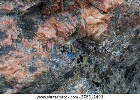 Northern stone texture and background. Granite. Quartz. Quartzite. Mica. Marble. Shungite. Basalt. Red and grey stones.