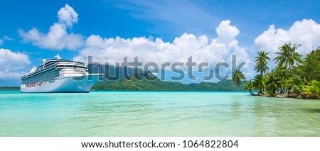 Summer cruise vacation travel. Luxury cruise ship anchored close to exotic tropical island.\
Panoramic landscape view of Bora Bora.