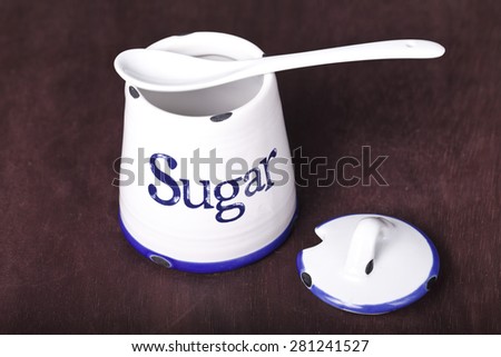 white ware for sugar on a brown background