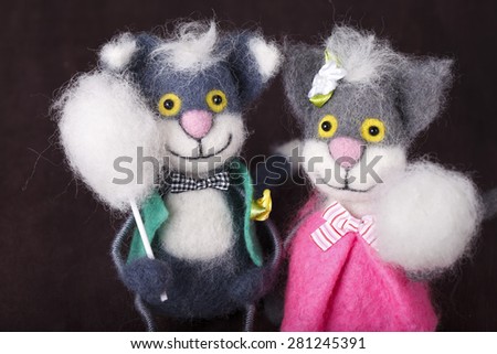 decorative toy cat with buttons instead of eyes