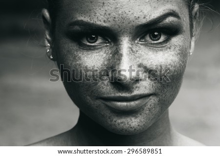 a beautiful girl portrait freckles black and white