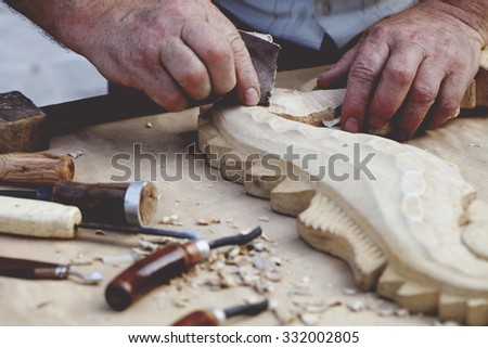 a wood carvings, tools and processes work closeup