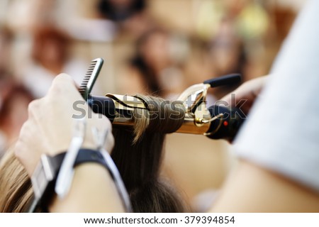 stylist hairdresser doing haircut closeup of work equipment, the beauty industry
