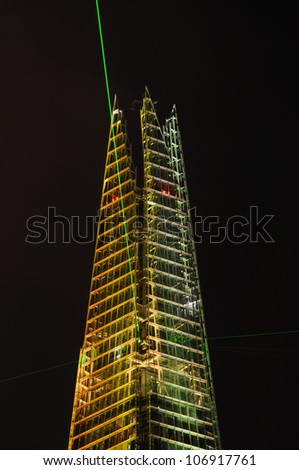 LONDON, UK - JULY 5: The Shard is opened with a light and laser show on July 5, 2012 in London. The Shard is the tallest building in Europe with 309,6 metres (1016 ft).
