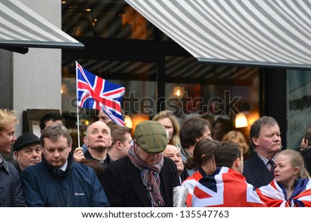 LONDON - UK, APRIL 17: The crowd waits for Baroness Thatcher funeral procession on Ludgate Hill, on April 17, 2013 in London.