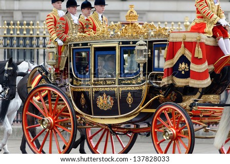 LONDON - UK, MAY 08: Queen Elizabeth II and Prince Philip leaving Buckingham Palace and going to the State Opening of Parliament on May 8, 2013 in London.