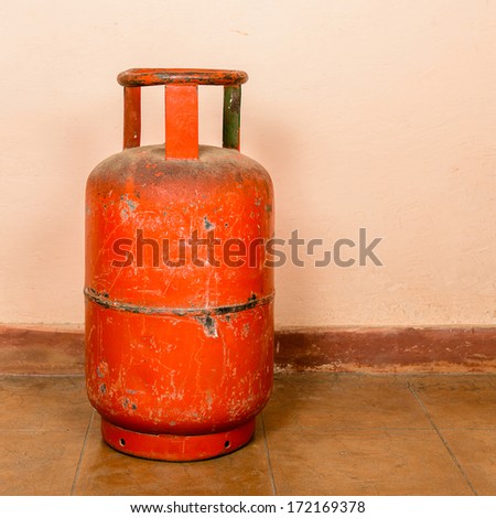 Red gas cylinder on pink cylinder