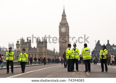 LONDON, UK - MARCH 26: Police officers during the march in central London against public spending cuts, March 26, 2011 in London, United Kingdom