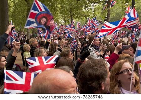 LONDON, UK - APRIL 29: The crowd waving their flags at the wedding of Prince William and Kate Middleton on the Mall, April 29, 2011 in London, United Kingdom