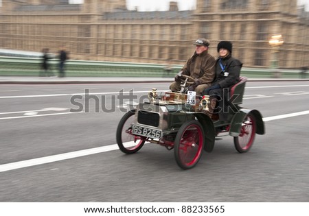 LONDON - NOVEMBER 06: London to Brighton Veteran Car Run participants crossing Westminster Bridge, on November 06, 2011 in London.