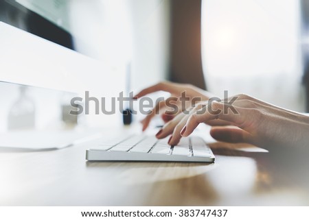 Close up of female hands typing on white keyboard, woman working at office and using modern computer and keyboard