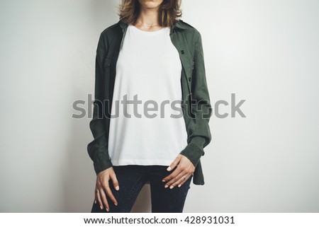 Young hipster girl wearing blank white t-shirt and green shirt, mock-up of white t-shirt in the white background