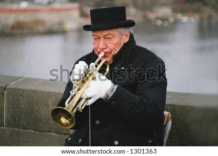 Street jazz musician playing the trumpet