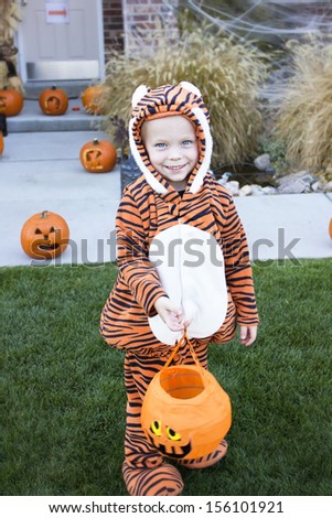 Little Boy in Costume Trick-or-treating on Halloween