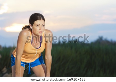 Female Runner finishing a run