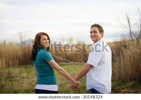 couples holding hands pictures. Young Couple Holding Hands