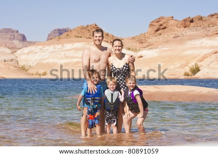 A beautiful young family on a fun vacation together at Lake Powell