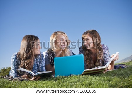 Three Young women studying in the outdoors
