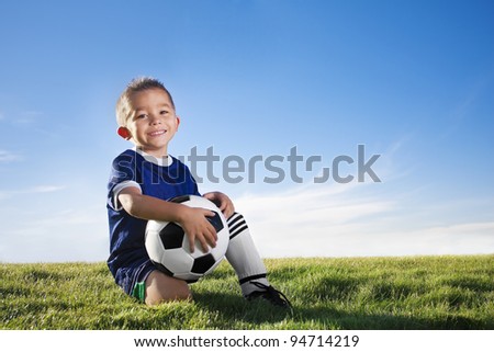 Young hispanic soccer player smiling