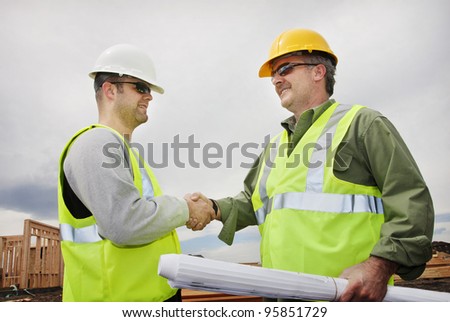 Two Construction Professionals Shaking Hands at the jobsite