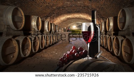 still life with red wine in old wine cellar