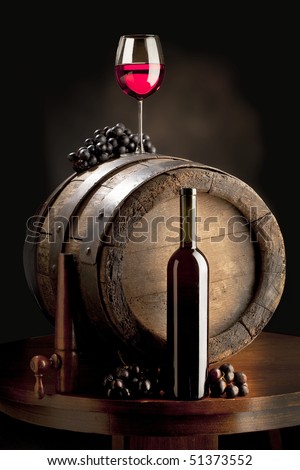 the still life with red wine, wine glass and old barrel