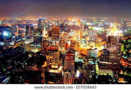 A View Over The Big Asian City Of Bangkok , Thailand At Nighttime When The Tall Skyscrapers Are Illuminated