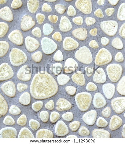 background of a floor with flat white stones in cement used in a bathroom, swimming pool and spa area\'s